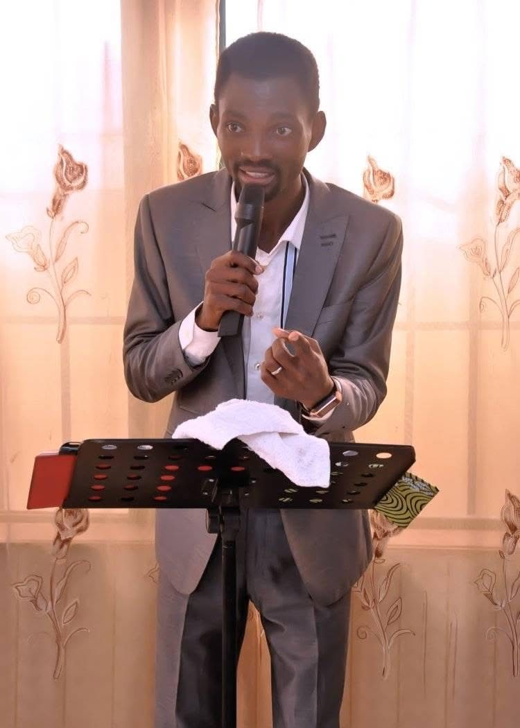 Pastor Popoola speaking at an event
