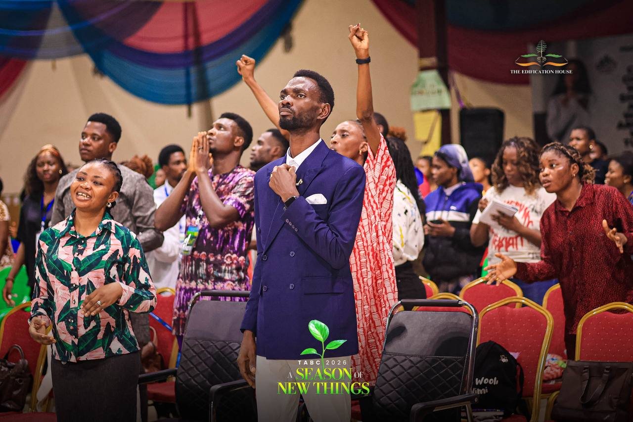 Pastor Popoola among people during worship