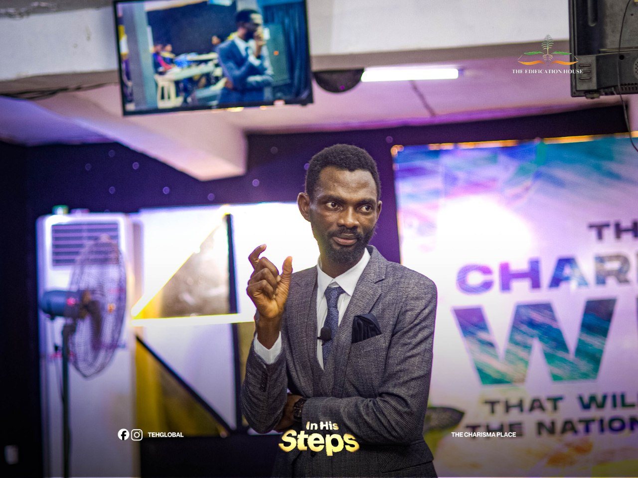 Pastor Popoola speaking to an audience